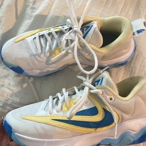 White, Blue, and Yellow Sneakers Giannis